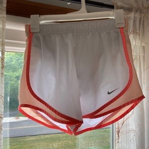 white and orange nike track shorts